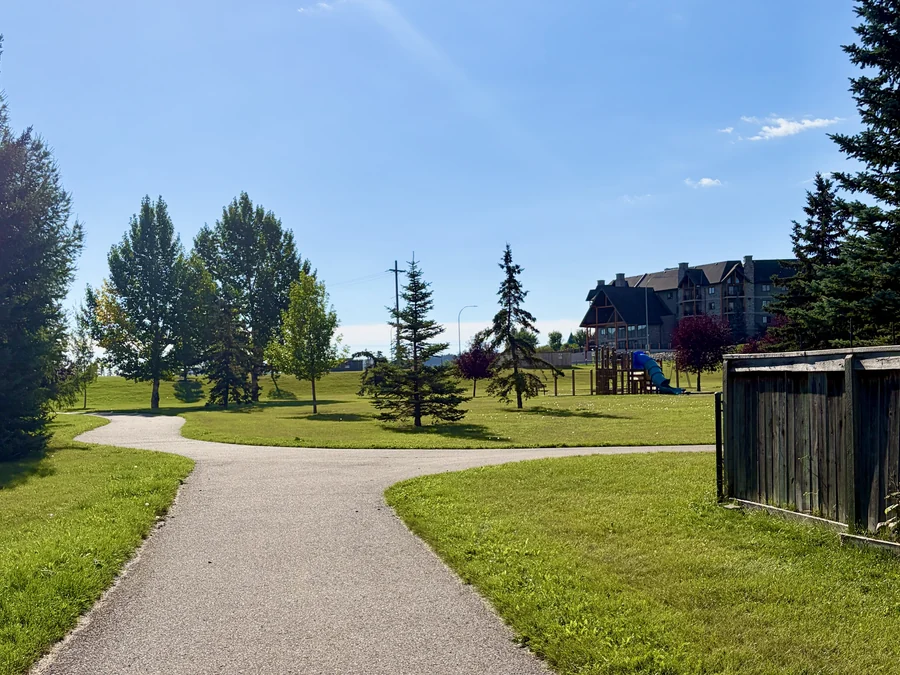 Pathway junction through the park in Bow Meadows, Cochrane, Alberta