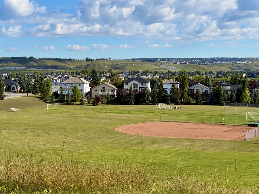 Ball diamond and homes in Bow Ridge, Cochrane, Alberta