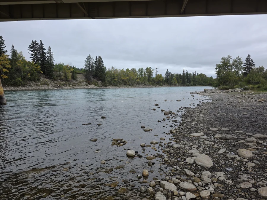 Gravel shore of the Bow River at Riverfront Park, Cochrane, Alberta