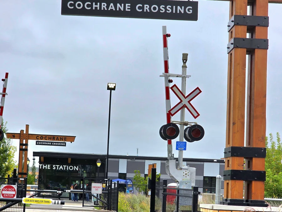 Cochrane Crossing and The Station at the railway crossing, downtown Cochrane, Alberta