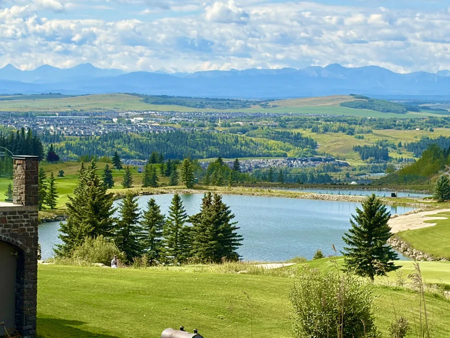 Pond on the GlenEagles golf course with the Rockies behind, Cochrane Alberta