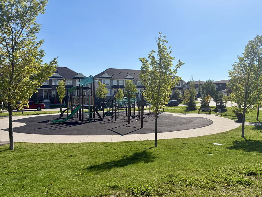 Playground and green space at The Willows, Cochrane, Alberta